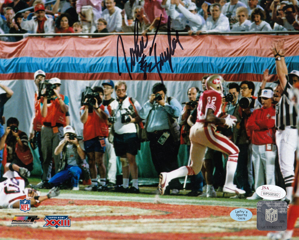 
                
                    Load image into Gallery viewer, John Taylor San Francisco 49ers Autographed 8x10 Photo (Horizontal, Running Into End Zone, Red Jersey)
                
            
