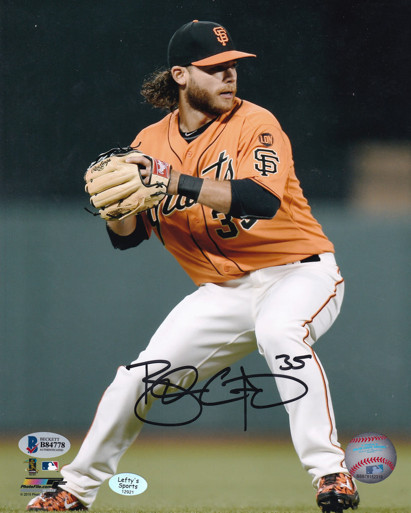 Brandon Crawford San Francisco Giants Autographed 8x10 Photo (Vertical, Throwing, Orange Jersey)